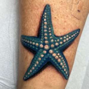 A cheap tattoo - blue starfish with drop shadow done at Mr Tattoo in Jacksonville