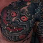 Japanese Hanya mask and dragon by guest artist Justin Essing at the best Jacksonville Tattoo Shop near me, Mister Tattoo